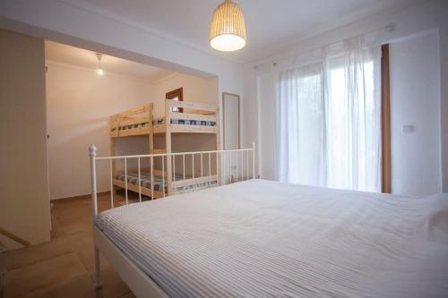 Postel nebo postele na pokoji v ubytování GAVRIADIA IERISSOS