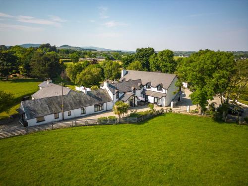 an aerial view of a large house with a green field at The Briers Country House in Newcastle