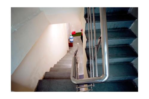 a stairway with a railing and a stair case at Rajdarshan Hotel in Ujjain