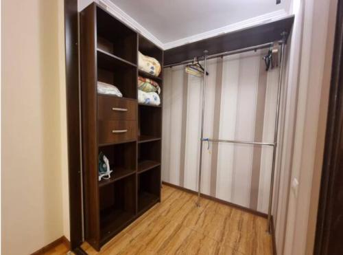 a walk in closet with a glass shower in a room at Home Hotel Apartments on Kontraktova Ploshcha in Kyiv