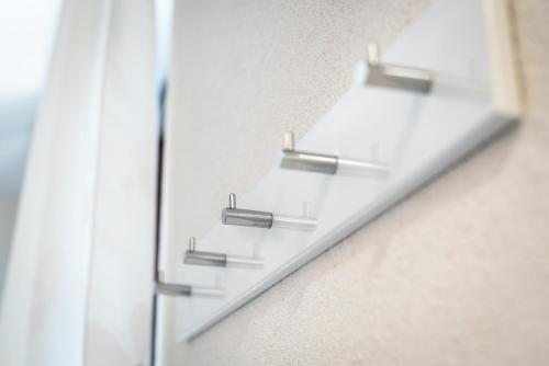 a glass shelf on the side of a wall at Apartments Vila Toni in Portorož