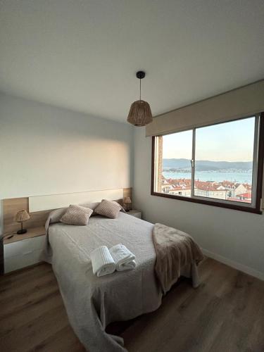 Ένα ή περισσότερα κρεβάτια σε δωμάτιο στο Apartamento Son Ría