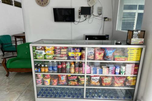 a refrigerator filled with lots of food and drinks at OYO LIFE 92844 Penginapan Cibodas in Pasuruan