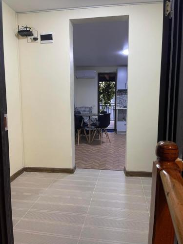 an open hallway with a view of a dining room at Flats at Era Square in Batumi