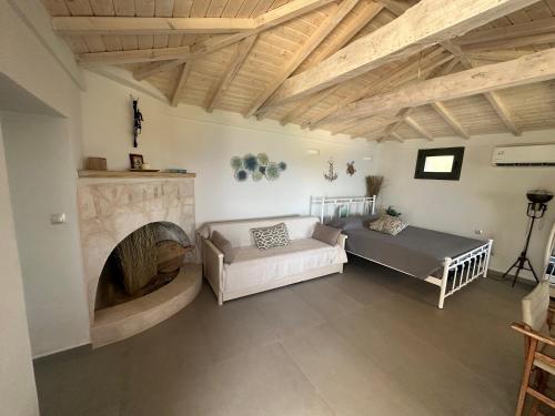 מיטה או מיטות בחדר ב-Maroudio's Villa