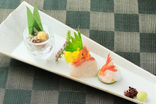 a white plate with three different types of sushi at Tensui Saryo in Hakone