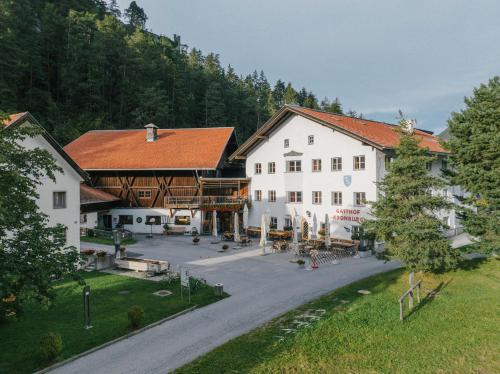 an aerial view of a large white building at Klostergut Kronburg in Zams