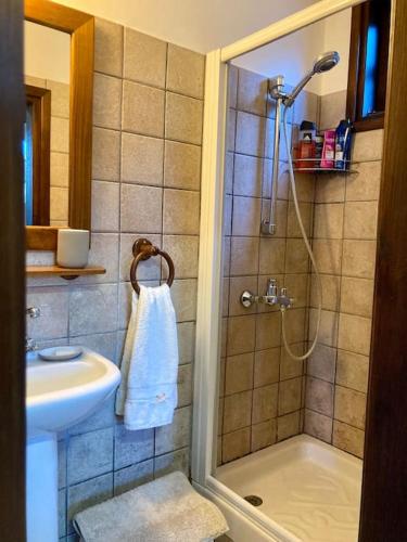a bathroom with a shower and a sink at Traditional House with Mountain View - Dierona Village in Dierona