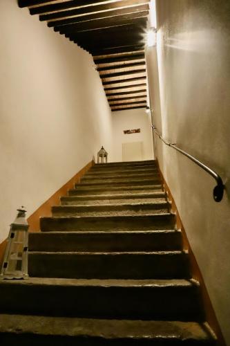 a set of stairs in an empty building at La Dimora Degli Etruschi in Celle sul Rigo