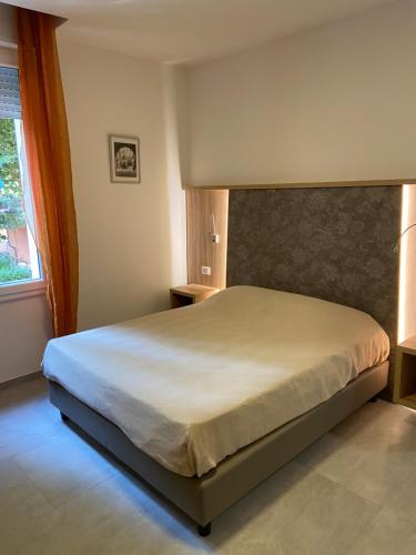 En eller flere senge i et værelse på Bondi900 - Tigli