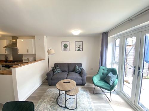 a living room with a couch and chairs and a table at Trade Stays Welcome Secure Parking Large Townhouse Long Stay Savings Available just Ask! in Birmingham