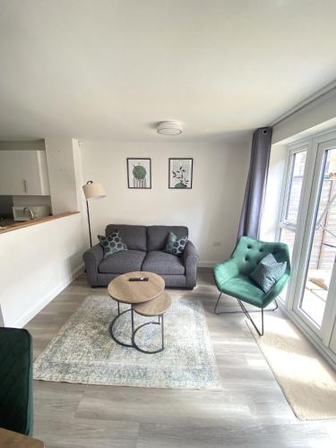 a living room with a couch and a table at Trade Stays Welcome Secure Parking Large Townhouse Long Stay Savings Available just Ask! in Birmingham
