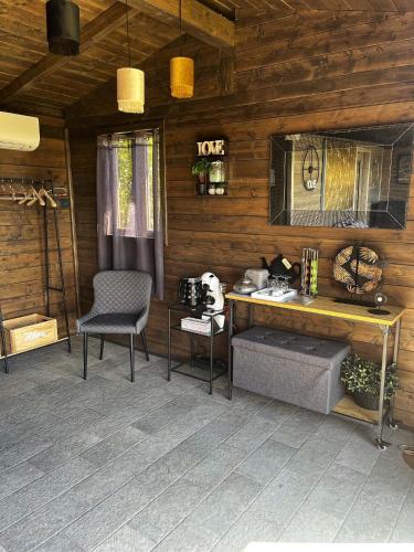 a room with a table and a chair and a desk at Agriturismo Annibale in Tuoro sul Trasimeno