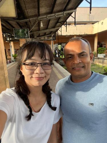 a man and a woman posing for a picture at SILVER RAIL in Galle