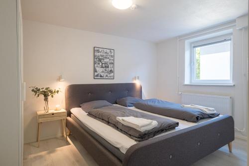 a large bed in a room with a window at Newly renovated 1-Bed Apartment in Aalborg in Aalborg