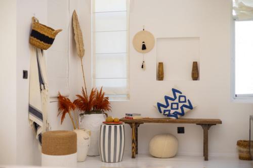a room with a table and some vases at ZOE ALAÇATI in Alacati
