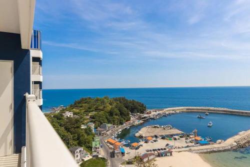 a view of a beach with boats in the water at Yangyang Ocean Stay in Yangyang