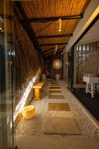 a room with a hallway with benches and a ceiling at ZOE ALAÇATI in Alacati