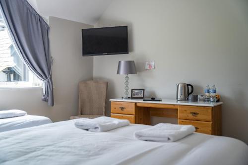 Voodi või voodid majutusasutuse The Briers Country House toas