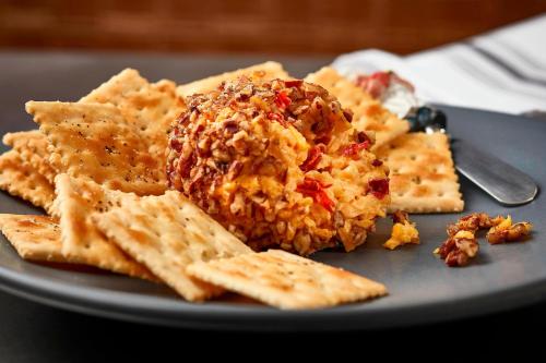 a plate of food with dip and crackers at Renaissance Nashville Hotel in Nashville