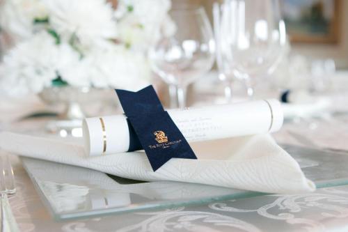 a table set with white napkins and a napkin at The Ritz-Carlton Osaka in Osaka