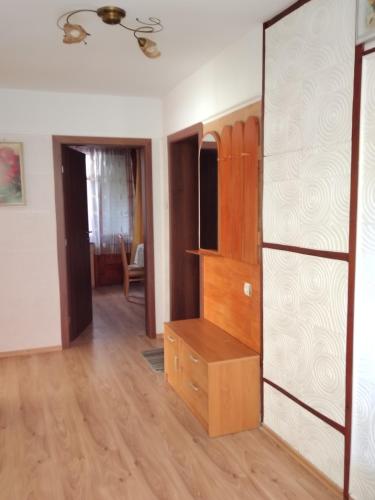 a room with a dresser and a chest of drawers at Apart Hotel Hetodon in Sozopol