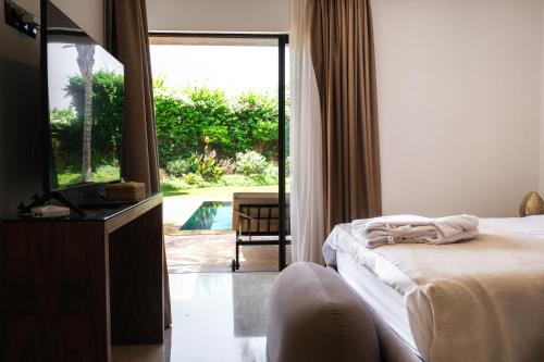 Katil atau katil-katil dalam bilik di VILLA STANISLAS GOLF RESORT AL MAADEN