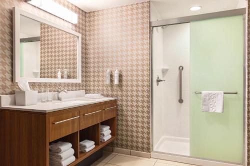 a bathroom with a sink and a shower at Home2 Suites by Hilton Lubbock in Lubbock
