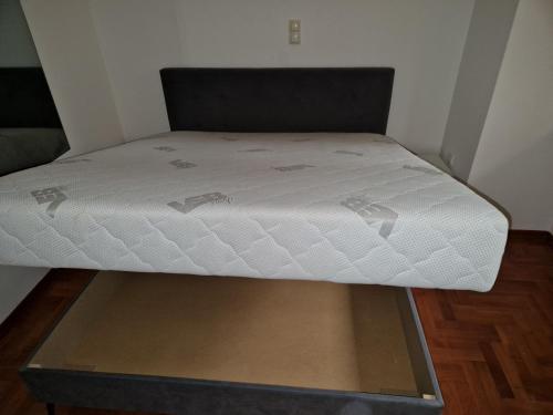 a bed in a small room with a mattress at Odmaralište Islovo Brdo in Prnjavor