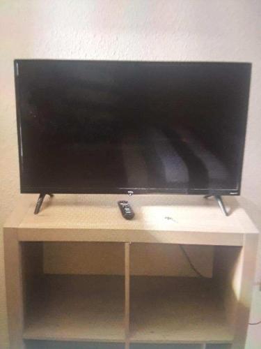 a flat screen tv sitting on top of a table at Lake house # 1 in Tacoma
