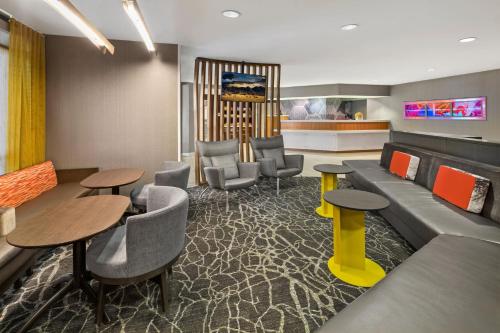 a lobby with a couch and chairs and tables at SpringHill Suites Austin Round Rock in Round Rock