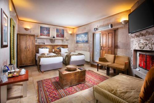 Кровать или кровати в номере Cappadocia Fairy Chimneys Selfie Cave Hotels - Special Class