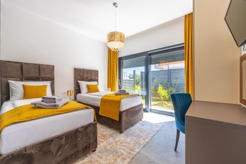 Ένα ή περισσότερα κρεβάτια σε δωμάτιο στο Villa Tiki