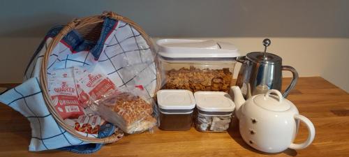 a table with a jar of food and a basket of food at Hillview in Inverness