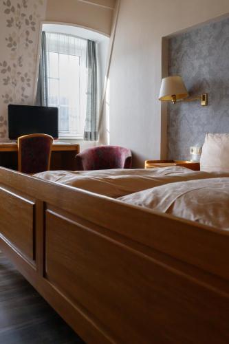 Postel nebo postele na pokoji v ubytování Schwarzes Lamm