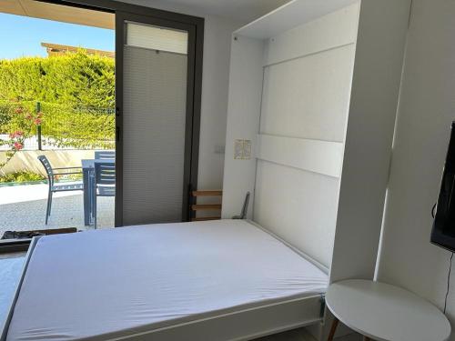 a small bedroom with a bed and a chair at Single Room at Adabuku Seba Solemar Holiday Site -Luxury Beach Utilities Included in Bogazici