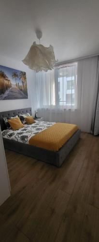a bedroom with a bed in a room at Apartament Near Sky Tower Free Parking for 2 cars in Wrocław