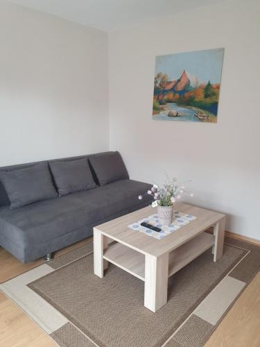 a living room with a couch and a coffee table at Privat Bartky in Vrbov