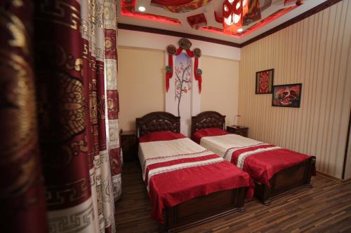 Кровать или кровати в номере Khiva Silk Road