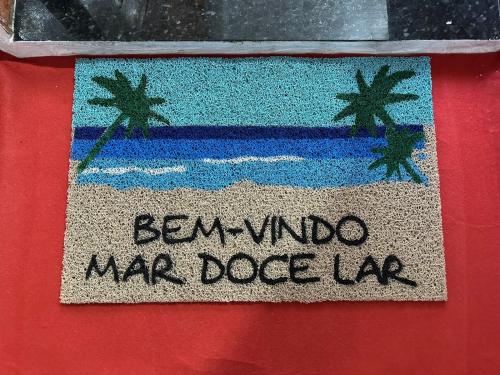 a flag with the words ben winds marquez mac dog lab at Apartamento frente ao mar com varanda e piscina in Praia Grande