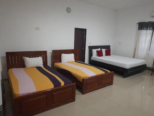 Кровать или кровати в номере New Sunrise Hotel