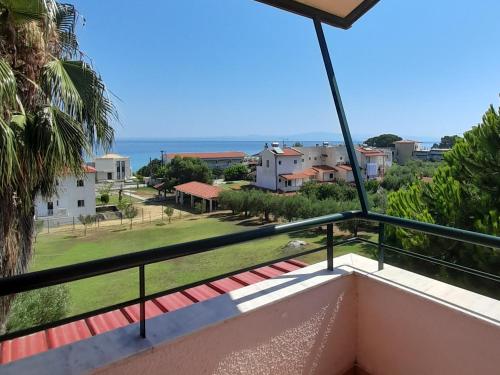 a balcony with a view of the ocean at Villa Aroma in Polykhrono