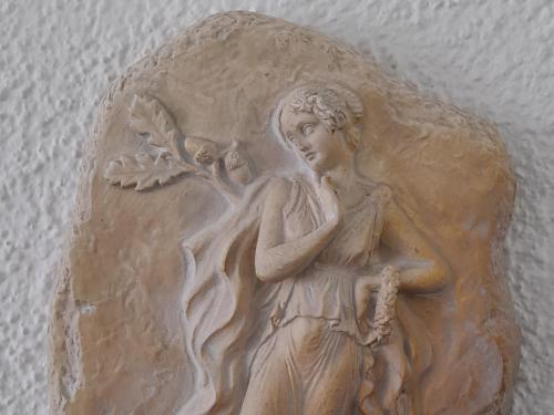 a wooden angel decoration on a wall at Villa Aroma in Polykhrono