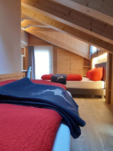 Llit o llits en una habitació de Al Sole B&B Valcomelico