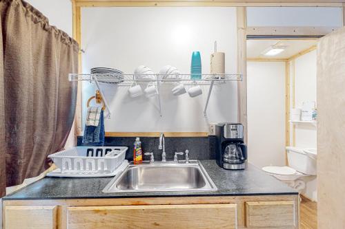 a kitchen with a sink and a counter top at Landyn's Lakeside Lodge in Kemp