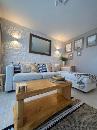 a living room with a blue couch and a table at Cannes Villa Francia in Cannes