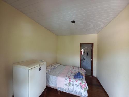 Una cama o camas en una habitación de Pousada Tupaiú