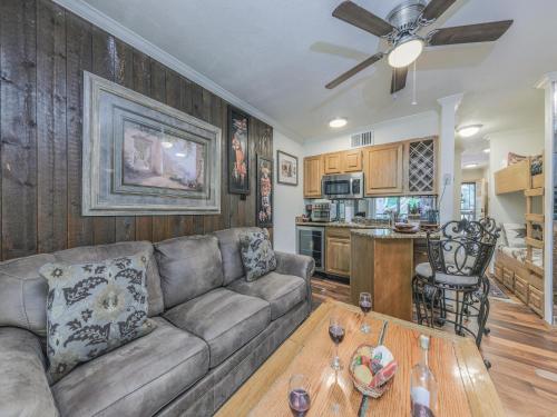 a living room with a couch and a table at Hunters Lodge in Ruidoso