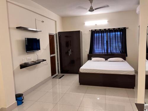Hotel Soft Petal tesisinde bir odada yatak veya yataklar