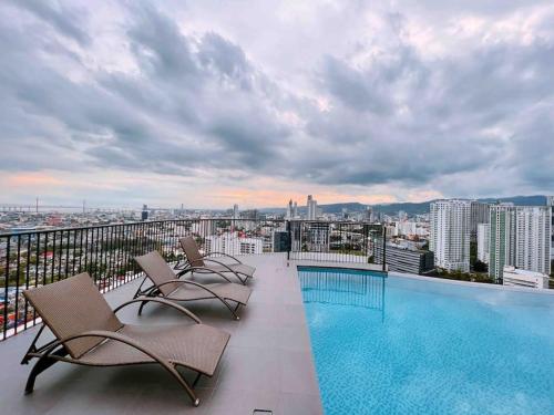 a swimming pool on the roof of a building at Calyx Residences by Hooga Home 3minutes walk to Ayala Center Cebu in Cebu City